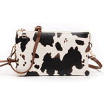 Load image into Gallery viewer, COW PRINT THREE COMPARTMENT WRISTLET
